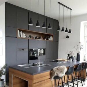 The industrial style steel Priddy 4 light pendant shade has a white interior to reflect a cleaner glow of light from within. Hang in your kitchen or dining room for practical yet contemporary lighting.