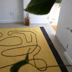 Featuring distinct organic linework set on a sunny yellow backdrop, this eye-catching piece was designed to evoke a sense of optimism and joy in your indoor spaces. Enjoy a superb softness underfoot with this rug’s handwoven 100% wool construction.
