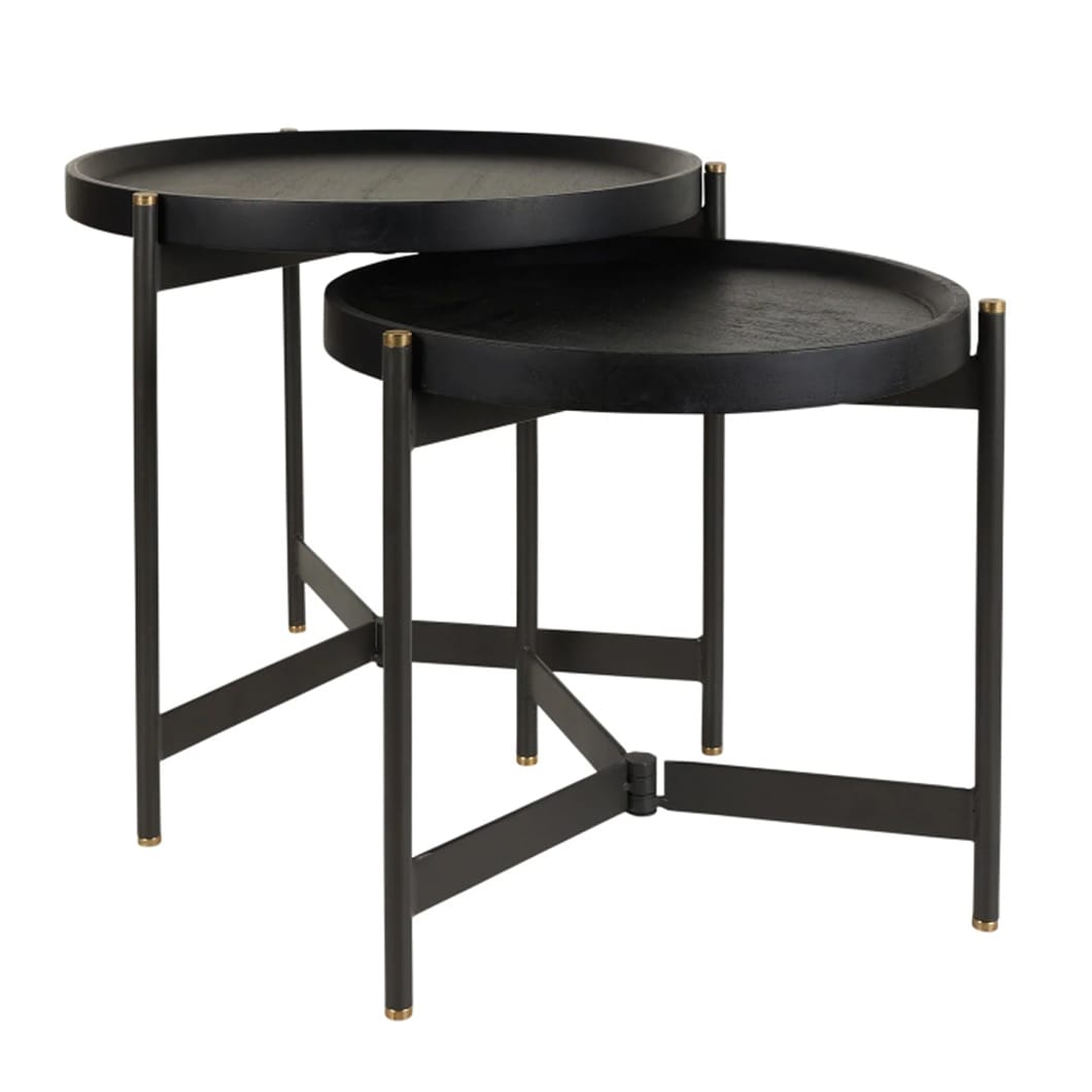 The Roundhouse table features a round top made of mango wood, powder-coated steel legs and solid brass finials. Its foldable legs offer ease of use, and the juxtaposition of wood and metal adds to its slick design. Roundhouse tables are available as both a coffee table and a more compact side table set, allowing you to combine them for a sense of cohesiveness or select them to meet your space requirements.