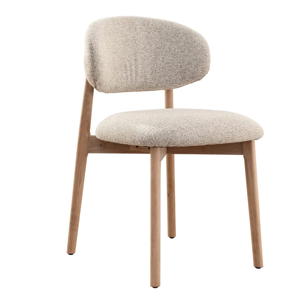 The clean, architectural lines of the Milano solid oak dining chair is a nod to modern design. Upholstered in luxurious 100% Polyester fabric and featuring a robust oak frame, this chair exudes both strength and sophistication. Whether placed at a dining table or in a reading nook, the Milano bridges the gap between contemporary and classic style. Ergonomically curved backrest. Available in two colourways.