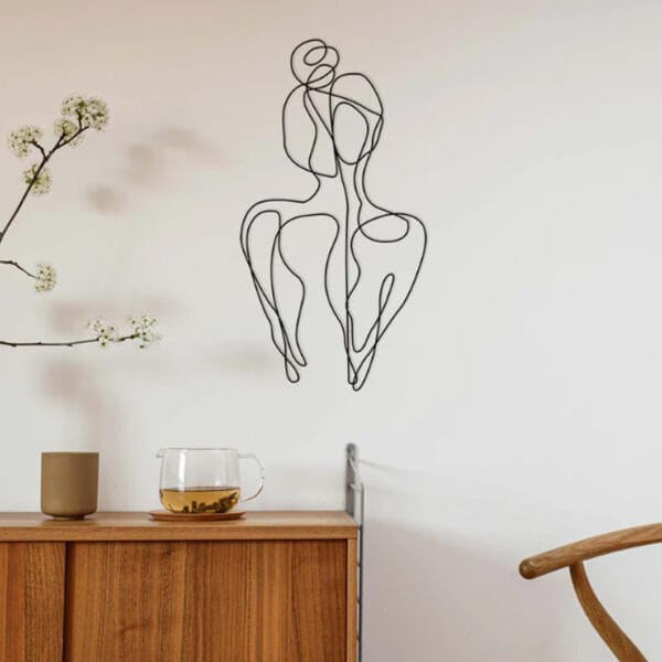 Ella : With a feminine and abstract design, Ella is the perfect piece to showcase in any room. Light weight galvanised wire, powder coated in matt black. Suitable for indoor or outdoor use.
