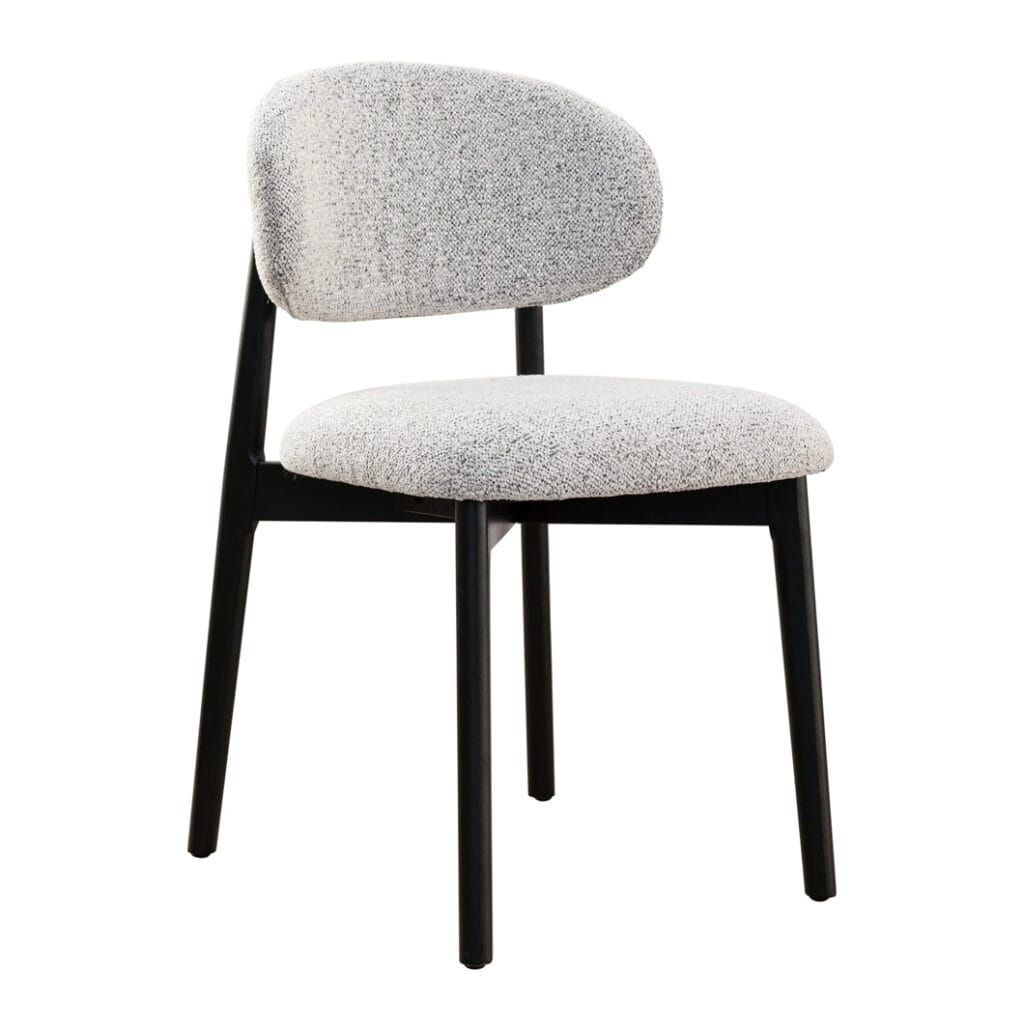The clean, architectural lines of the Milano solid oak dining chair is a nod to modern design. Upholstered in luxurious 100% Polyester fabric and featuring a robust oak frame, this chair exudes both strength and sophistication. Whether placed at a dining table or in a reading nook, the Milano bridges the gap between contemporary and classic style. Ergonomically curved backrest. Available in two colourways.