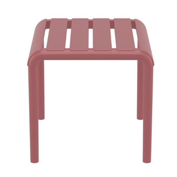 The side table is a stacking footrest/side table for outdoor use made of fiberglass resin with UV protection and presented as a functional footrest. For indoor and outdoor use.