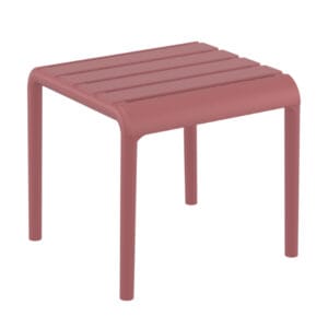 The side table is a stacking footrest/side table for outdoor use made of fiberglass resin with UV protection and presented as a functional footrest. For indoor and outdoor use.