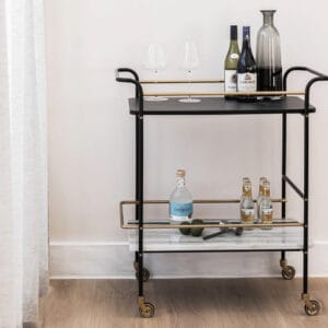 Cheers to our Sable drink trolley, the ultimate party companion that is sure to elevate your hosting game. Composed of marble, mango wood and steel, this versatile piece is perfect for showcasing your favourite drinks and glassware. A must-have for any home bar or entertainment area. Minor assembly required.