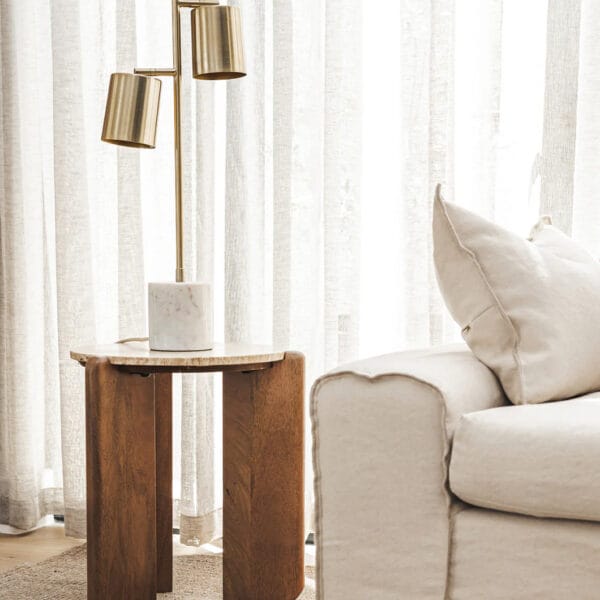 Our boldly proportioned Cascade range of side tables and coffee tables blends the warmth of wood with the cool sophistication of stone. Crafted by hand, these head-turners feature legs made of solid mango wood and a travertine tabletop, which mimics the classic appeal of marble with its polished finish. Minor assembly required